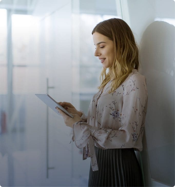 Business professional managing serverless cloud operations on a tablet
